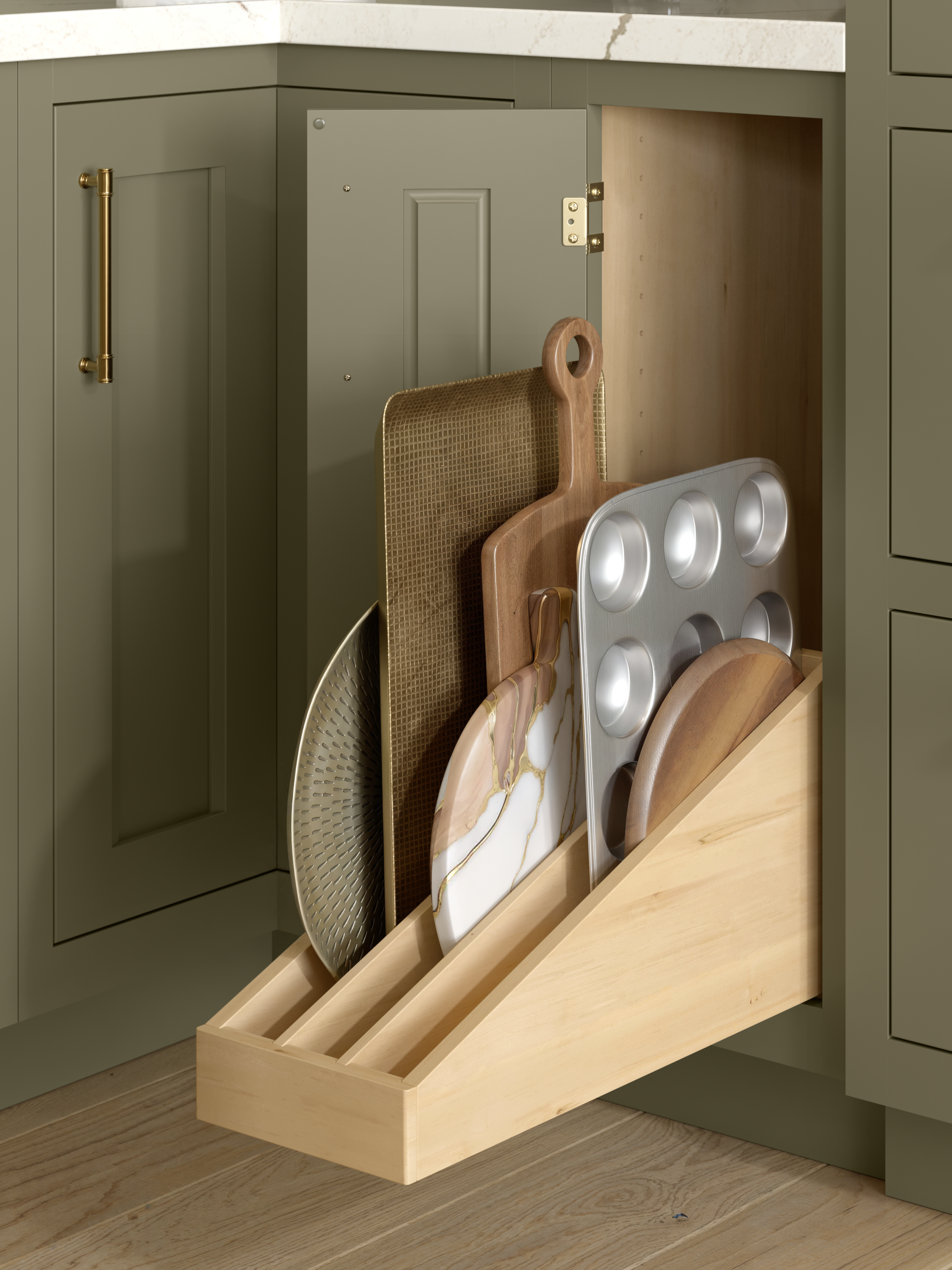 Open kitchen cabinet with a pull-out drawer containing various cutting boards and kitchen tools.