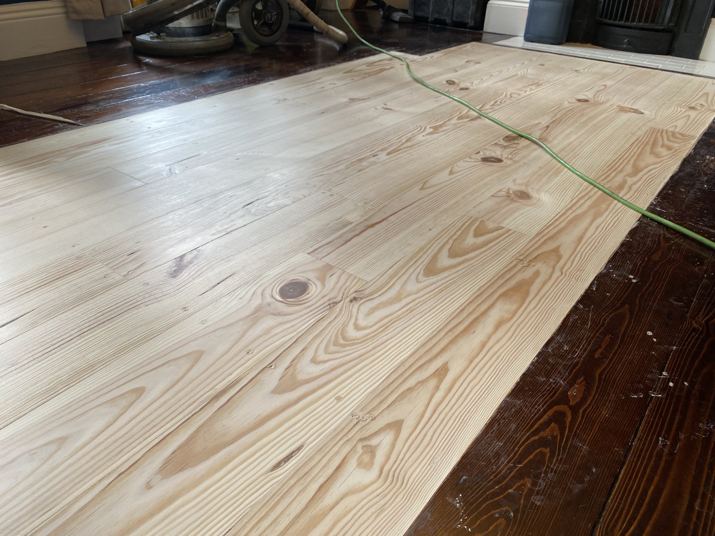Pine floorboard repair after sanding and filling, prepared for staining in Bournville Birmingham