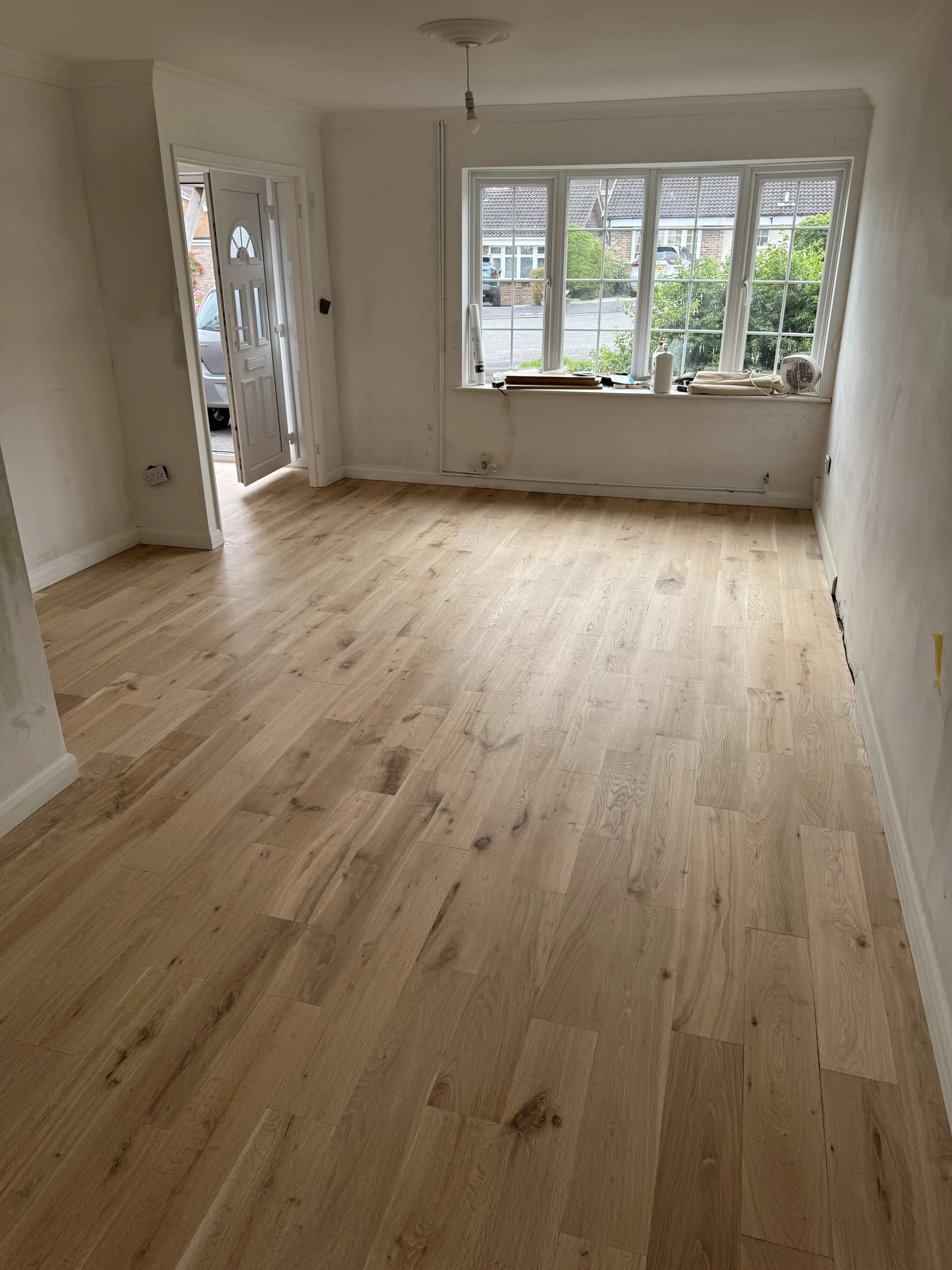 Solid oak floor restoration and repairs, hand-scraped finish
