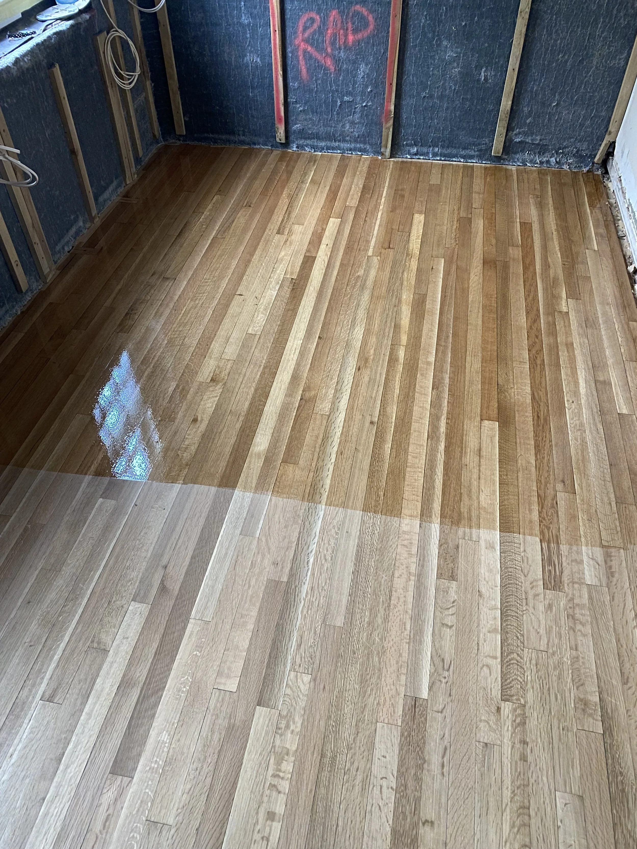 Solid oak strip wood floor sanded and restored with an oil finish at Florence Boot Hall, University of Nottingham.
