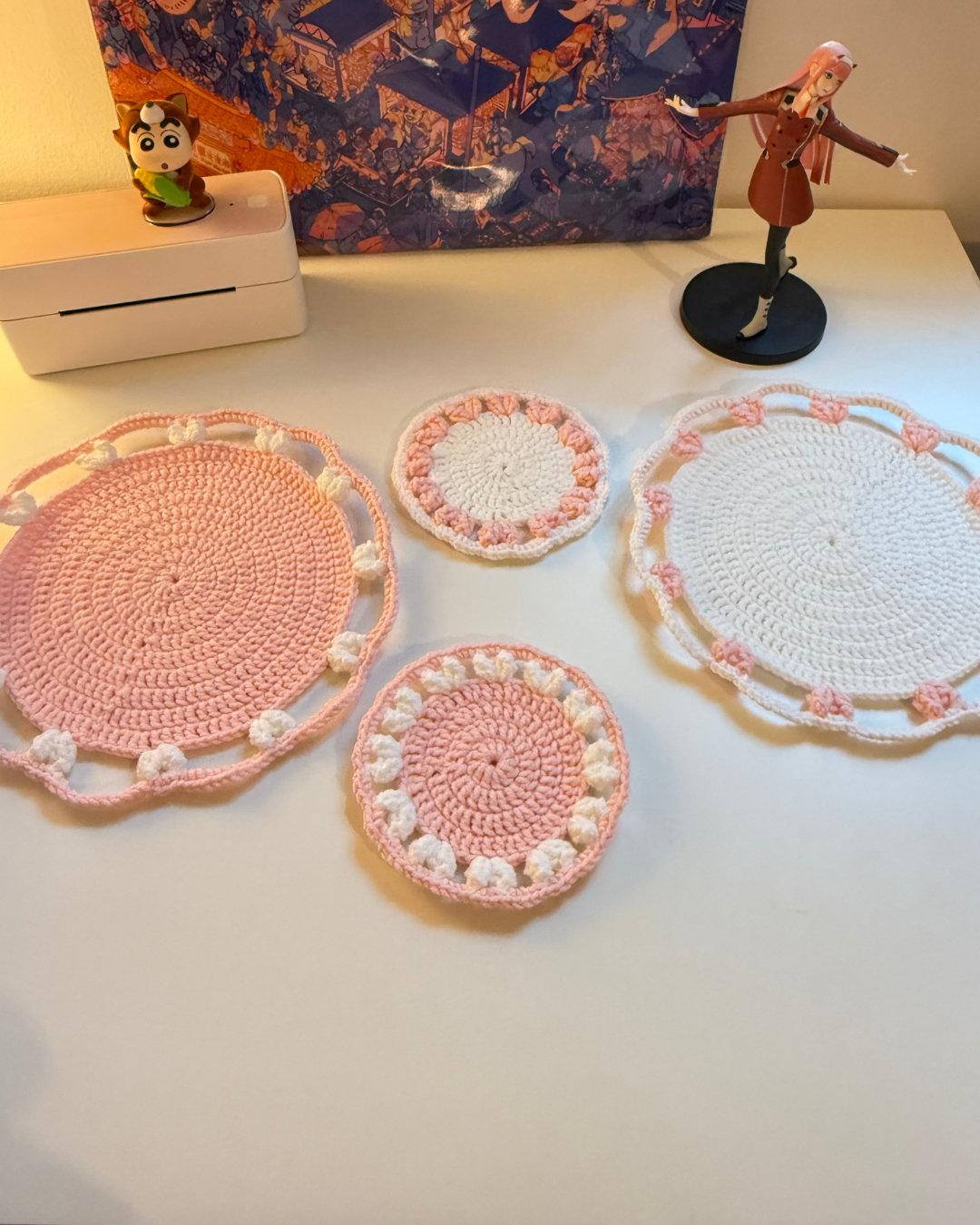 crochet-coasters-pink-and-white-display-on-table.png