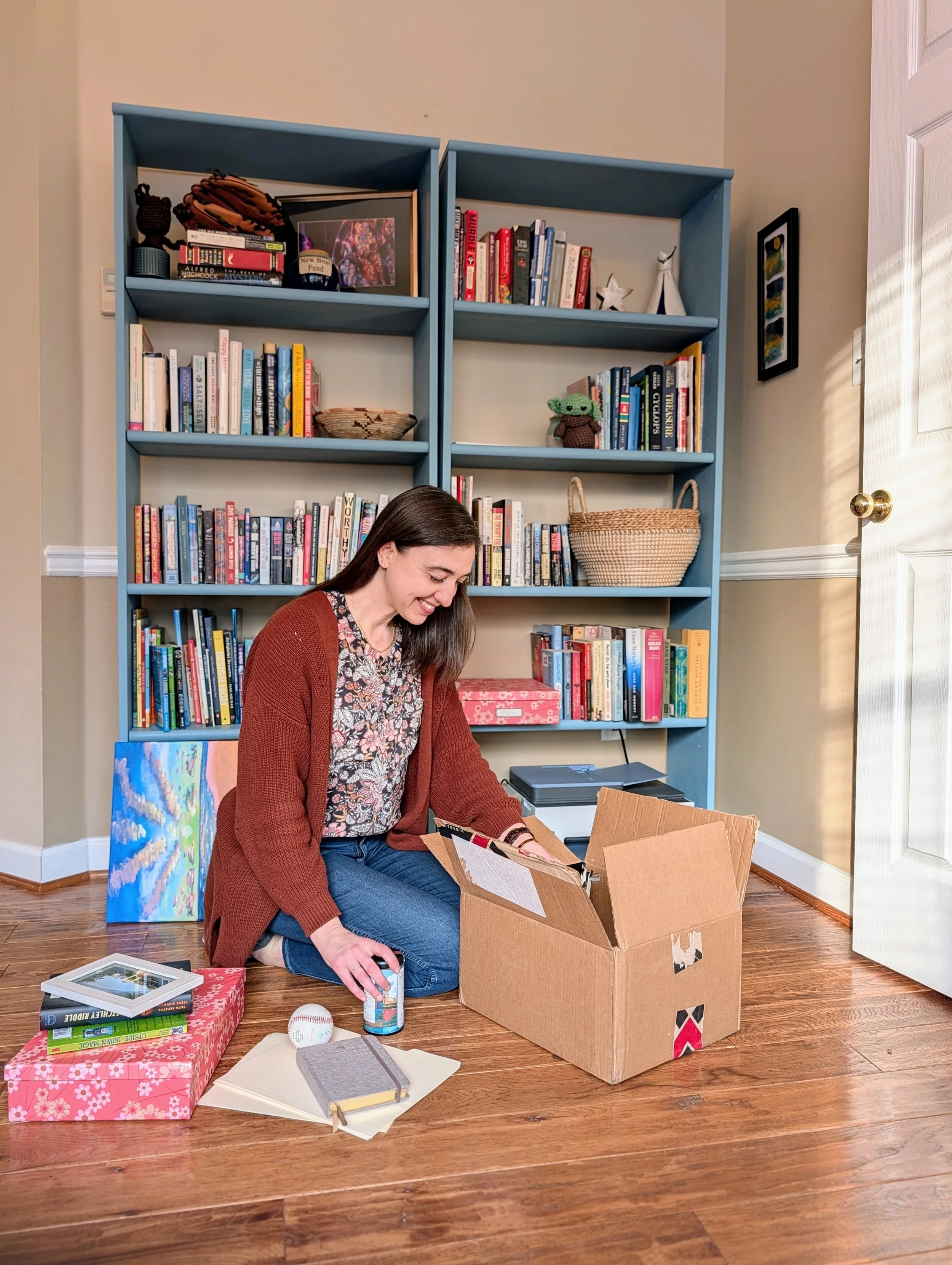 Business owner decluttering a bookshelf