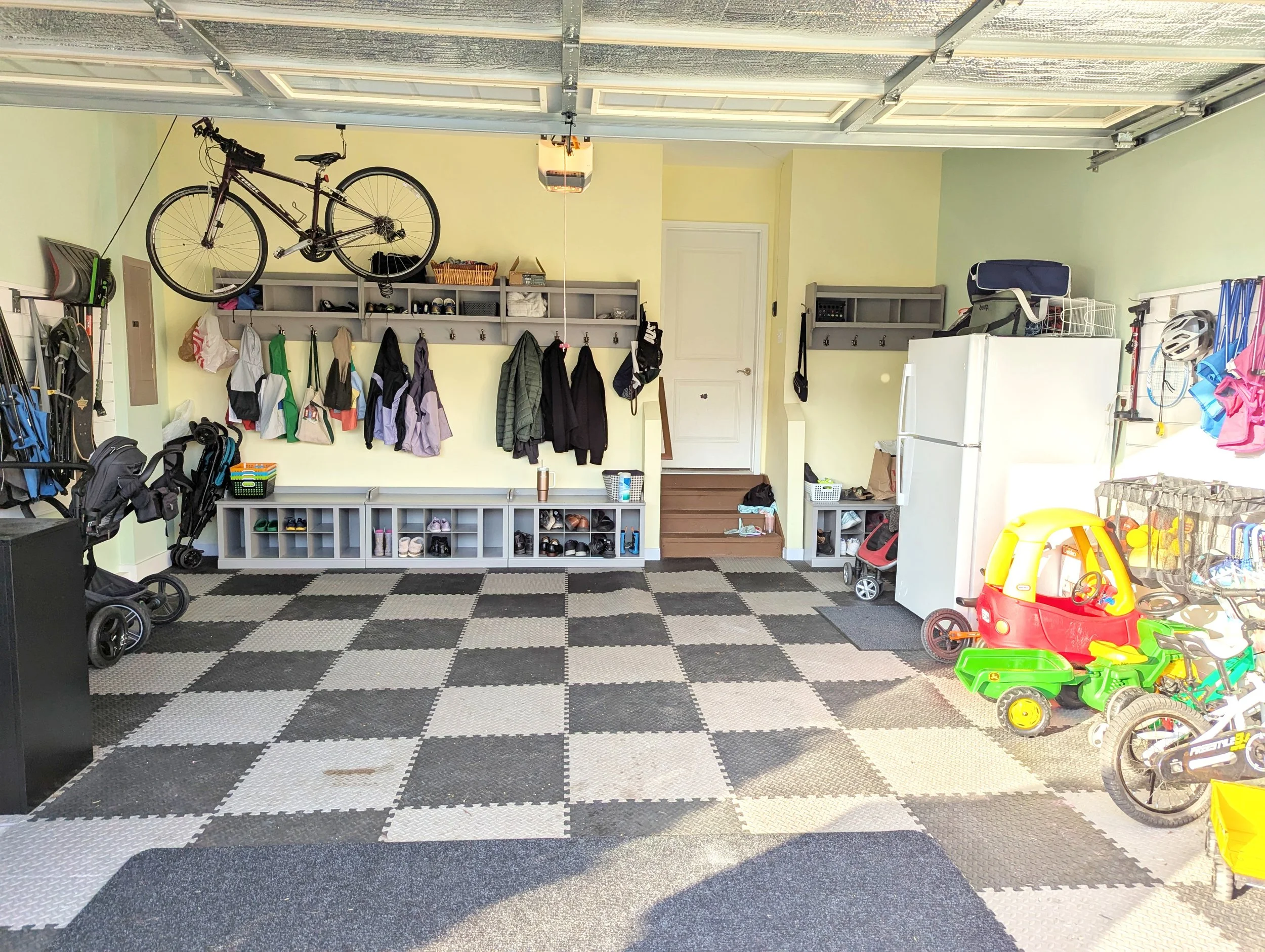Organized garage, mudroom, and toy parking