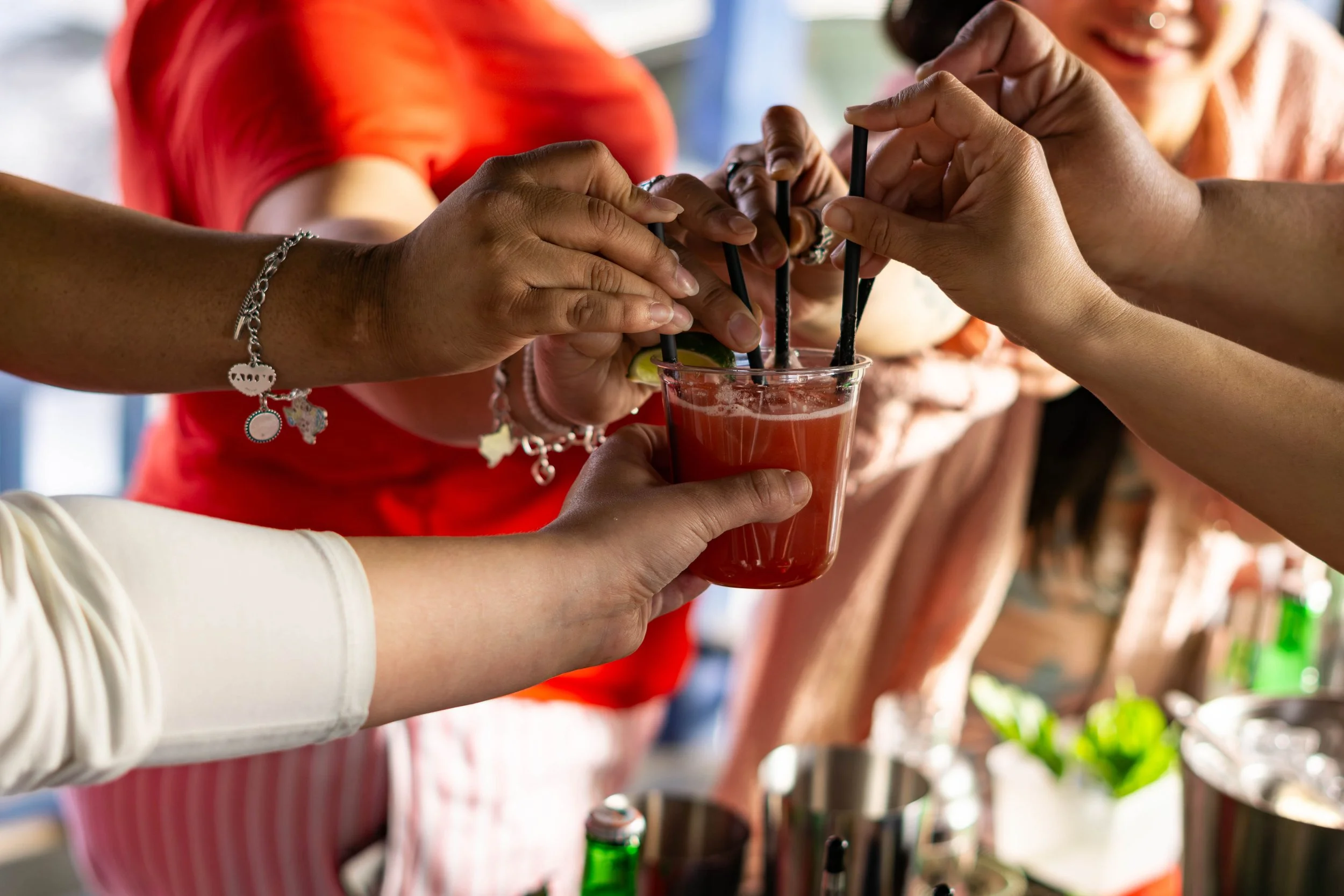 Guest Cheering to Cocktails - The Cosmic Pour Beverage Experience