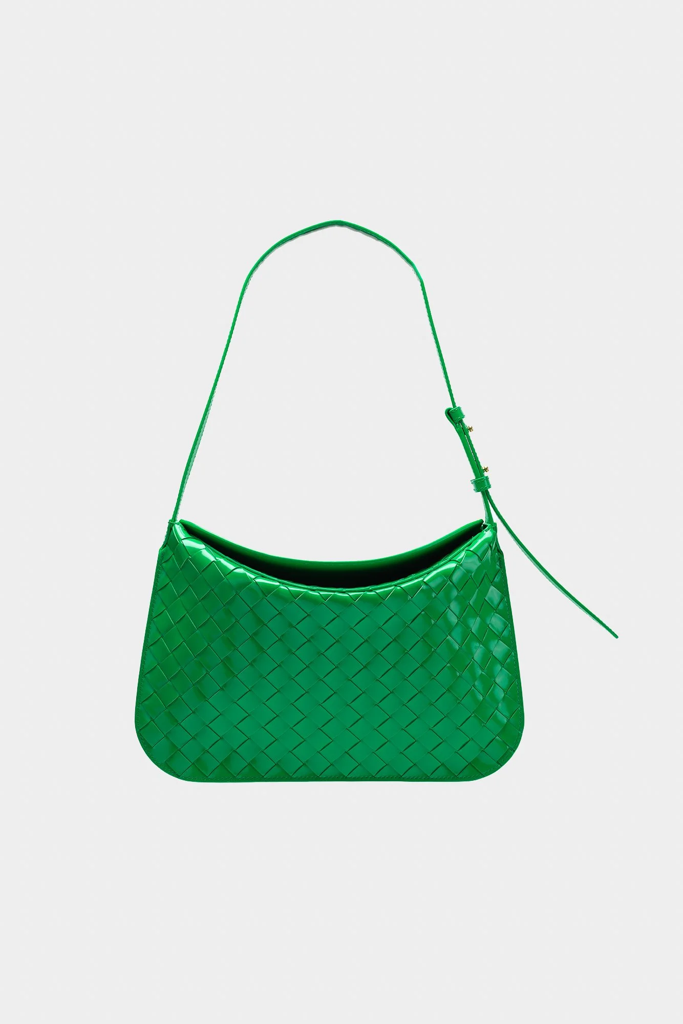 Green woven leather shoulder bag with adjustable strap against a plain background.