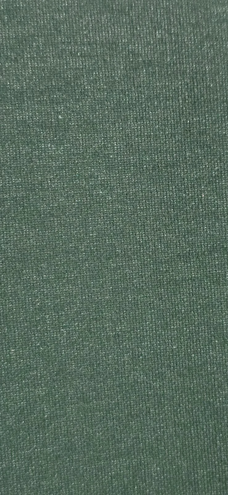 Close-up of green textured fabric or material with detailed weave pattern.
