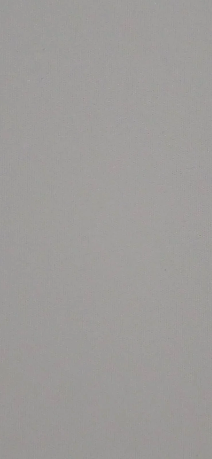 Plain, light gray textured surface or wall.