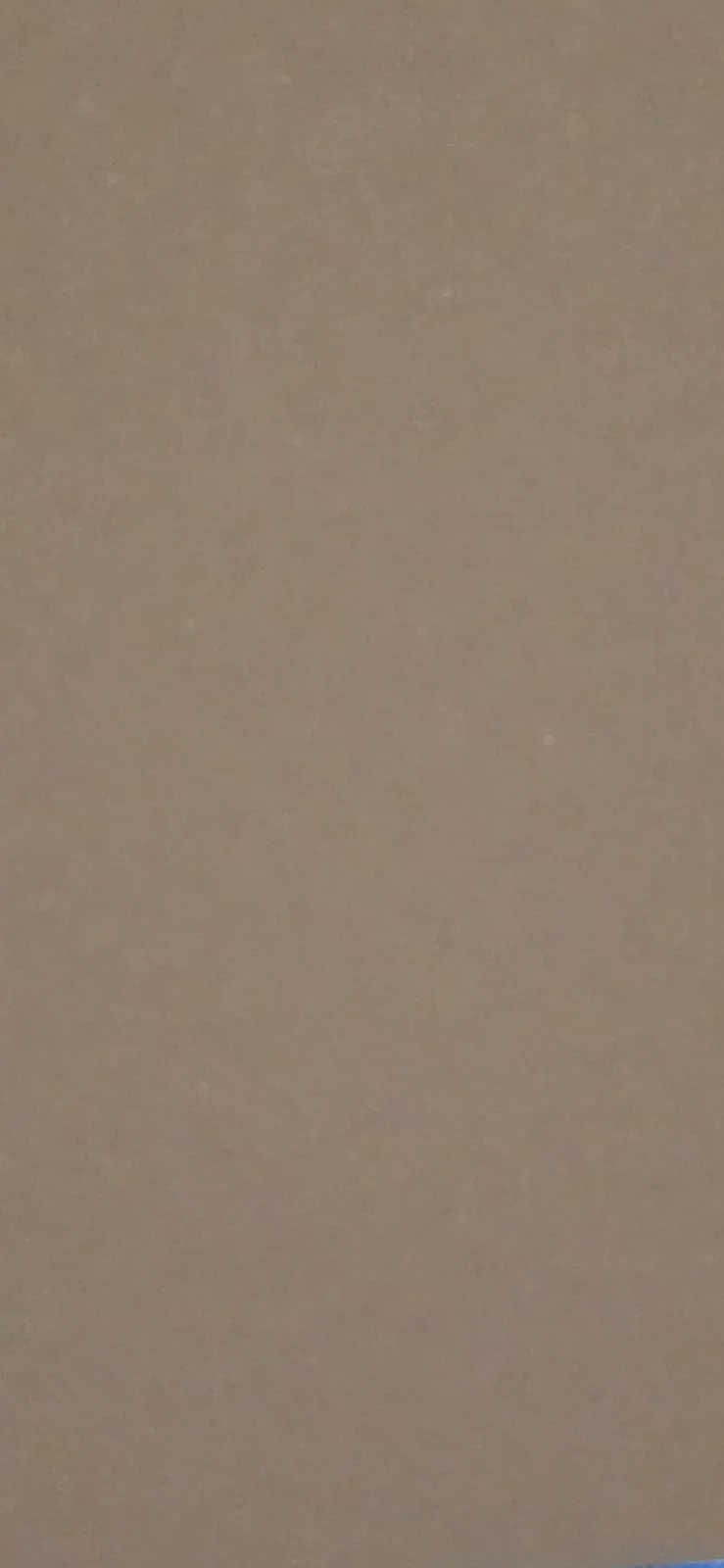A plain, beige wall with no visible features or objects.