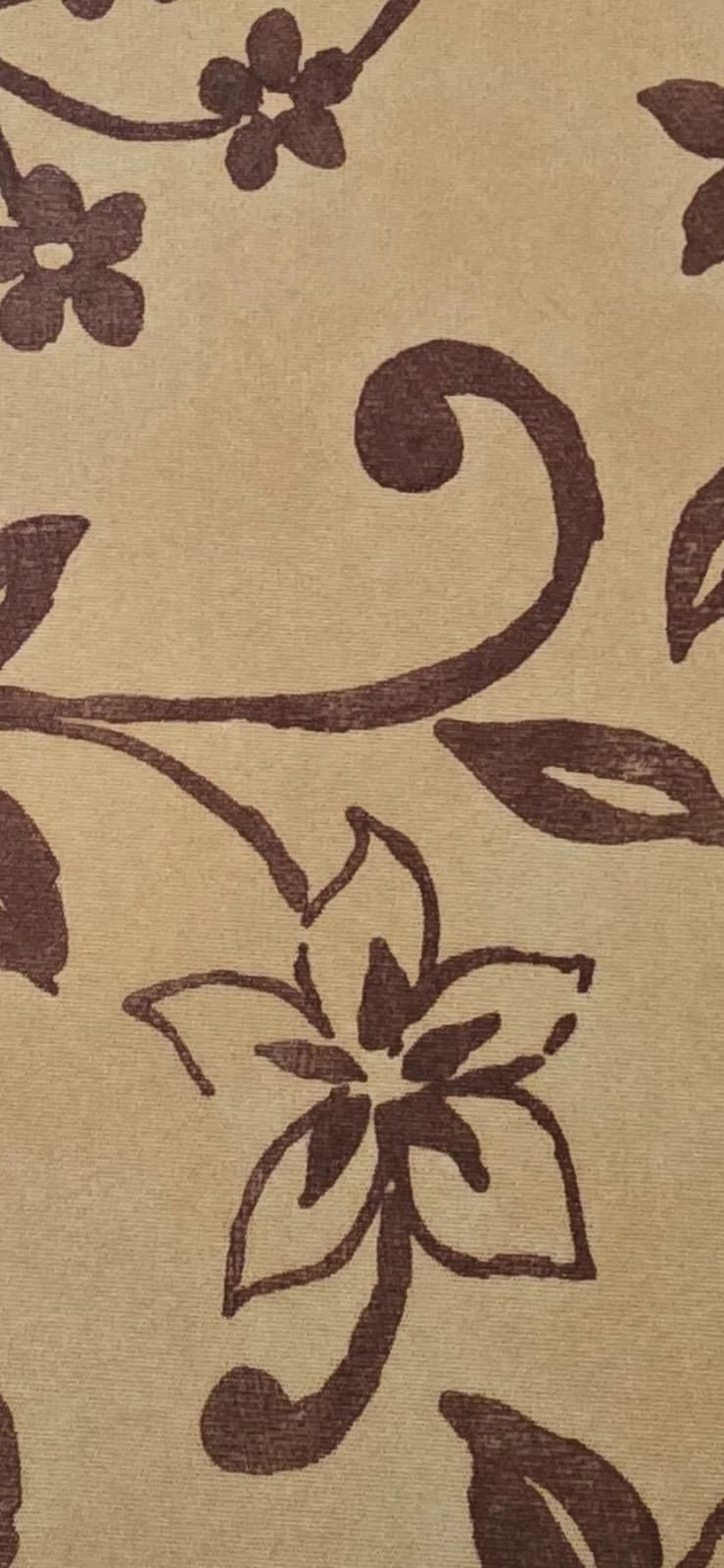 Pattern featuring dark floral and vine motifs on a beige background.