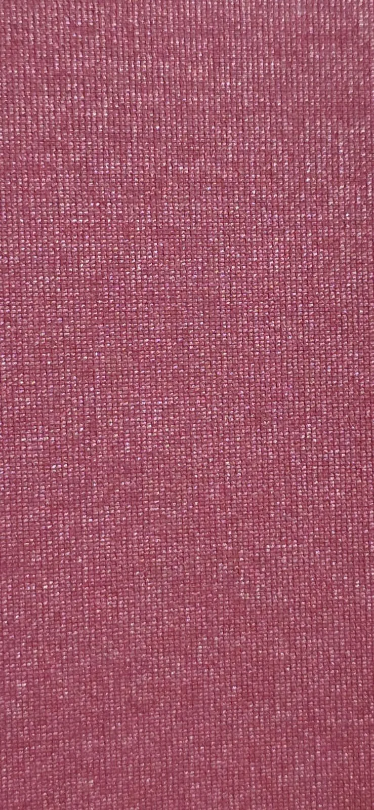 Close-up of a textured, pink fabric surface.