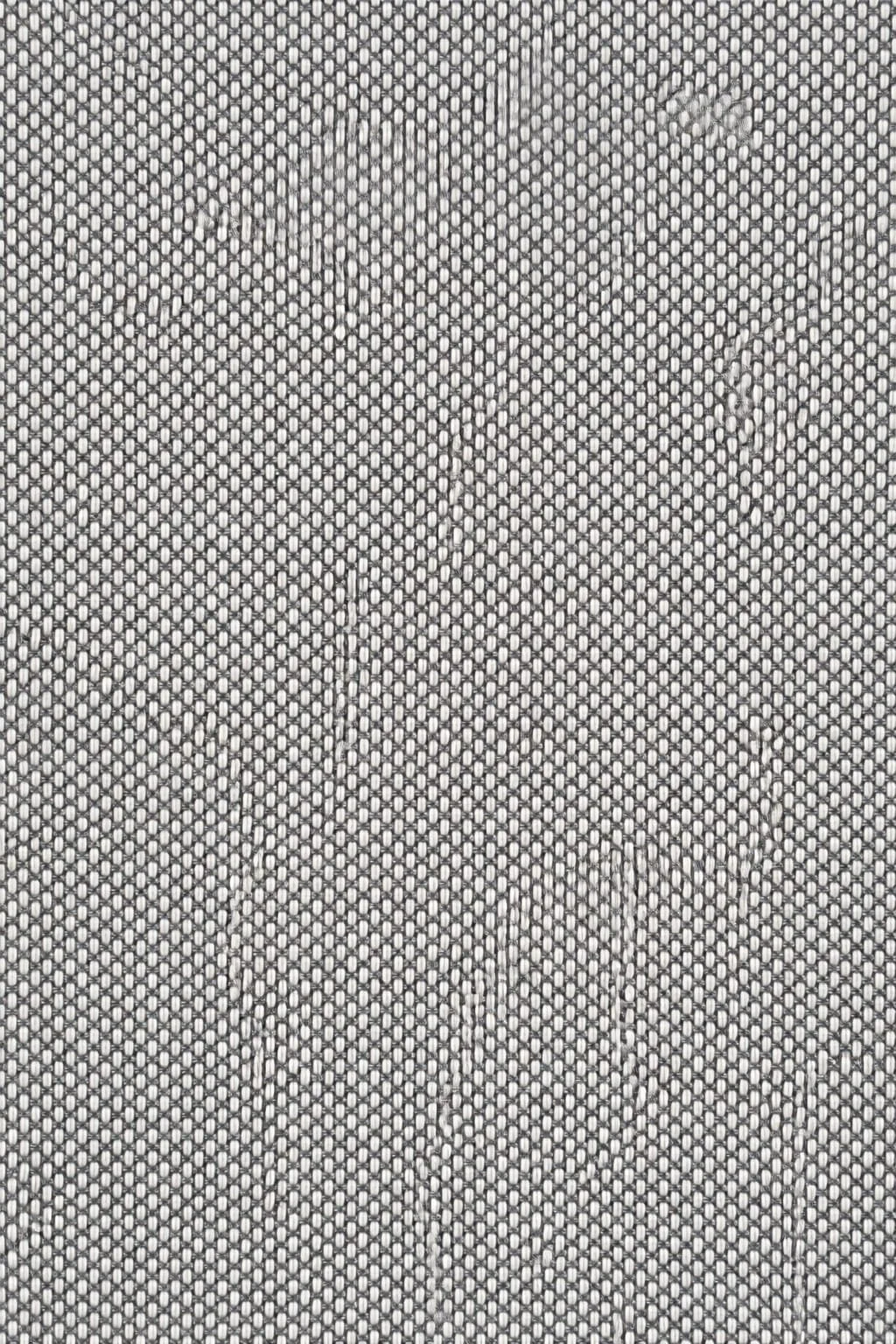 Close-up view of a textured metal surface with a vertical crack and some scratches.