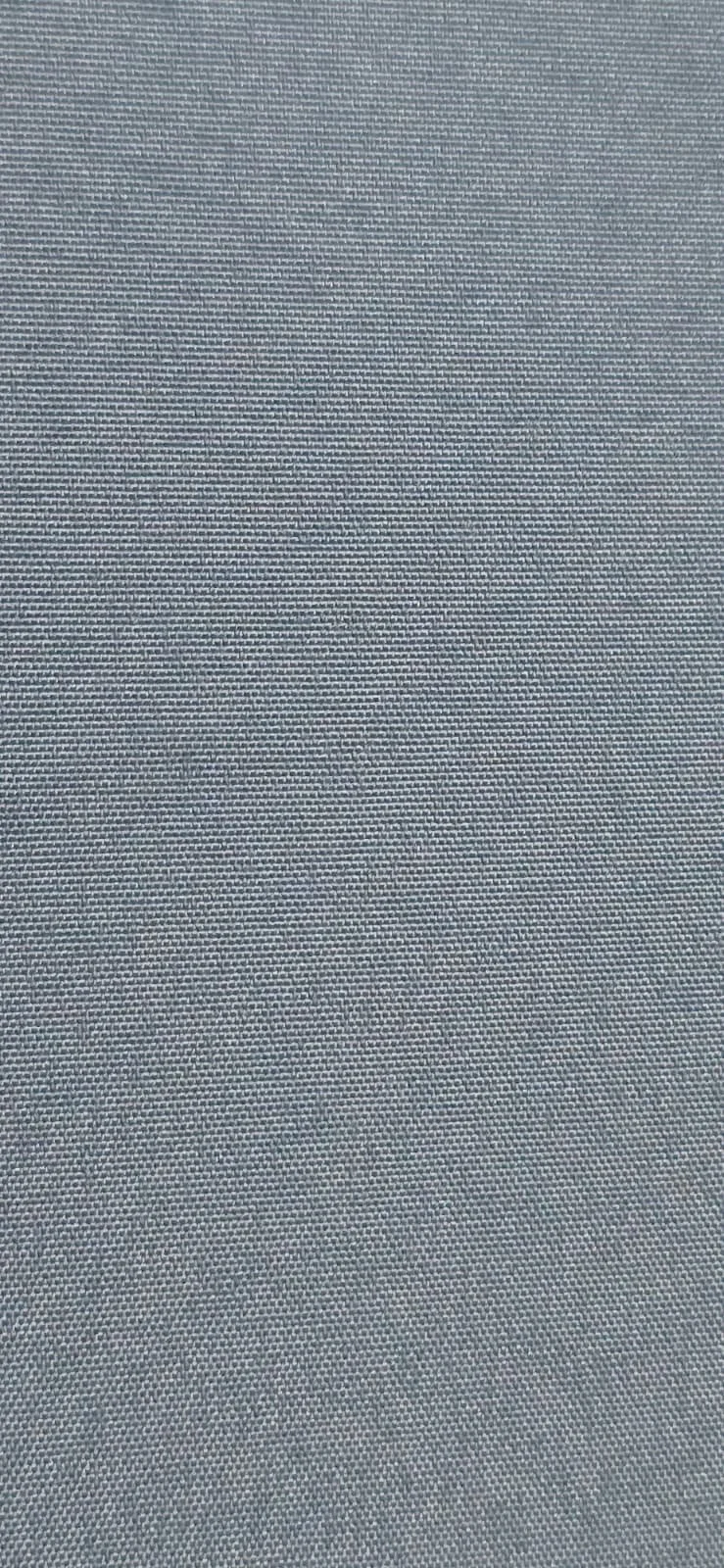 Close-up of a textured fabric surface, possibly upholstery or a curtain.