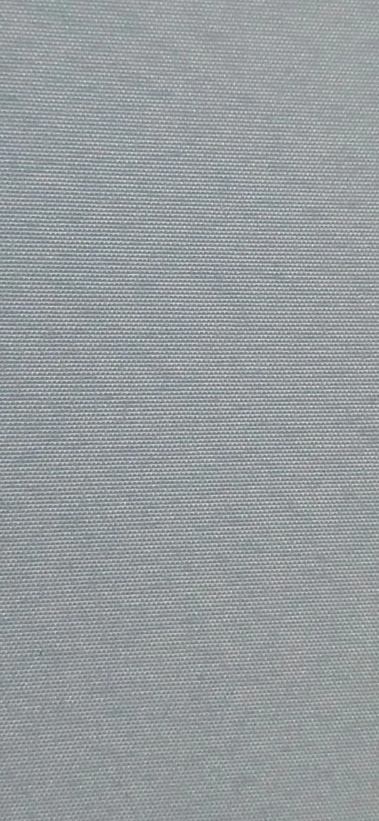 Close-up of a textured, woven gray fabric or mesh material.