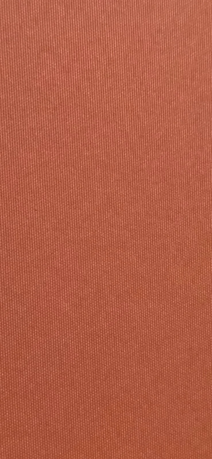 Close-up of textured orange fabric surface.