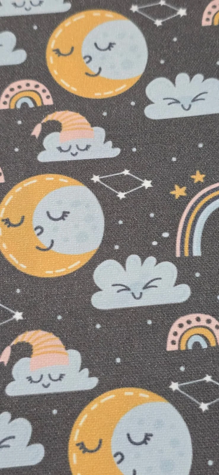 Pattern featuring smiling cartoon clouds, moons with closed eyes, rainbows, and star constellations on a dark background.