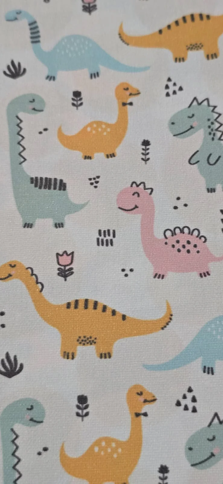 Pattern with cartoon dinosaurs of different colors and styles, surrounded by small flowers and abstract shapes on a white background.