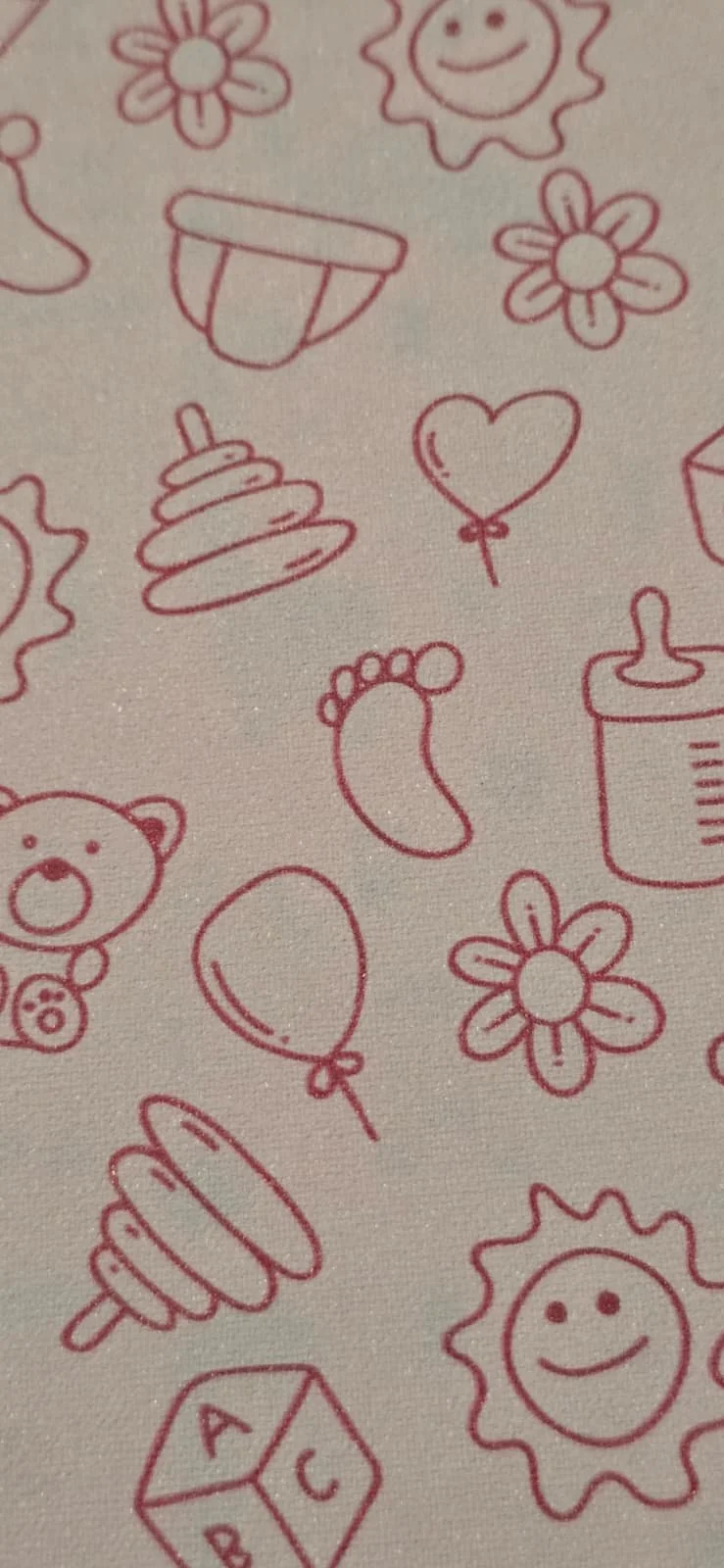 Line drawings of children's toys and playful elements, including teddy bears, balloons, flowers, a heart-shaped balloon, a stacking ring toy, a foot, a sun with a smiling face, and a toy block with the letters A, B, and C.