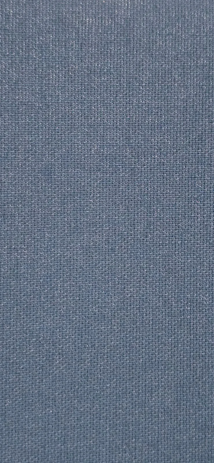 Close-up of a textured, dark blue fabric surface.
