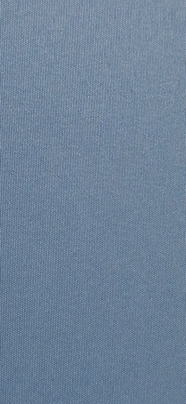 Close-up view of a textured blue fabric surface.
