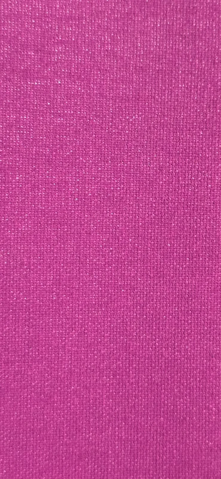 Close-up of pink fabric with a woven texture.