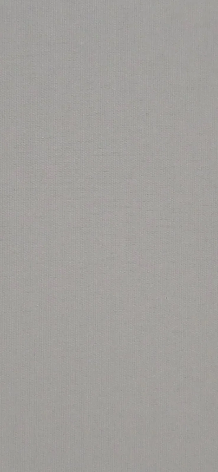 Close-up of a white textured wall surface.
