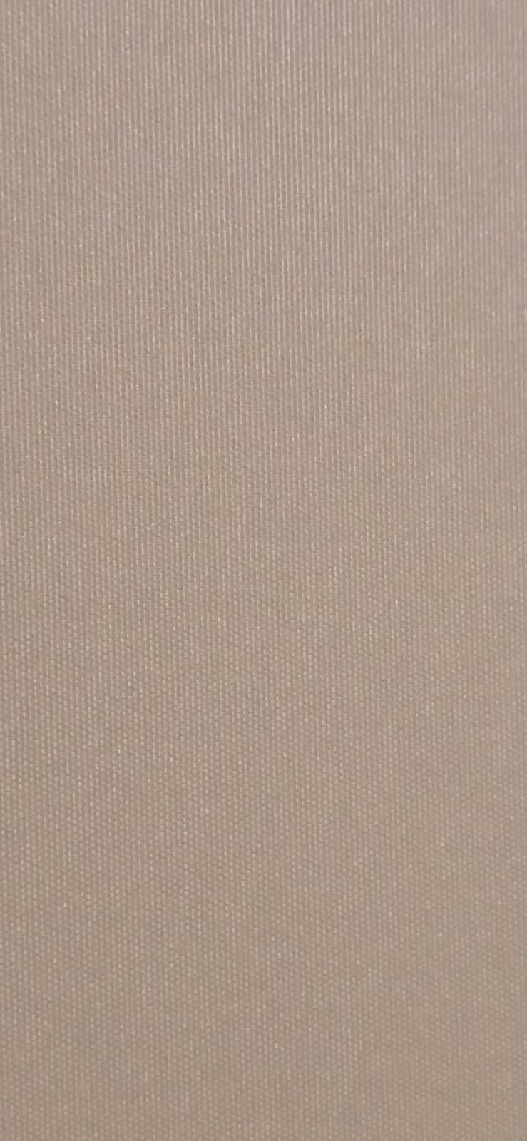 Close-up of beige textured fabric or material.