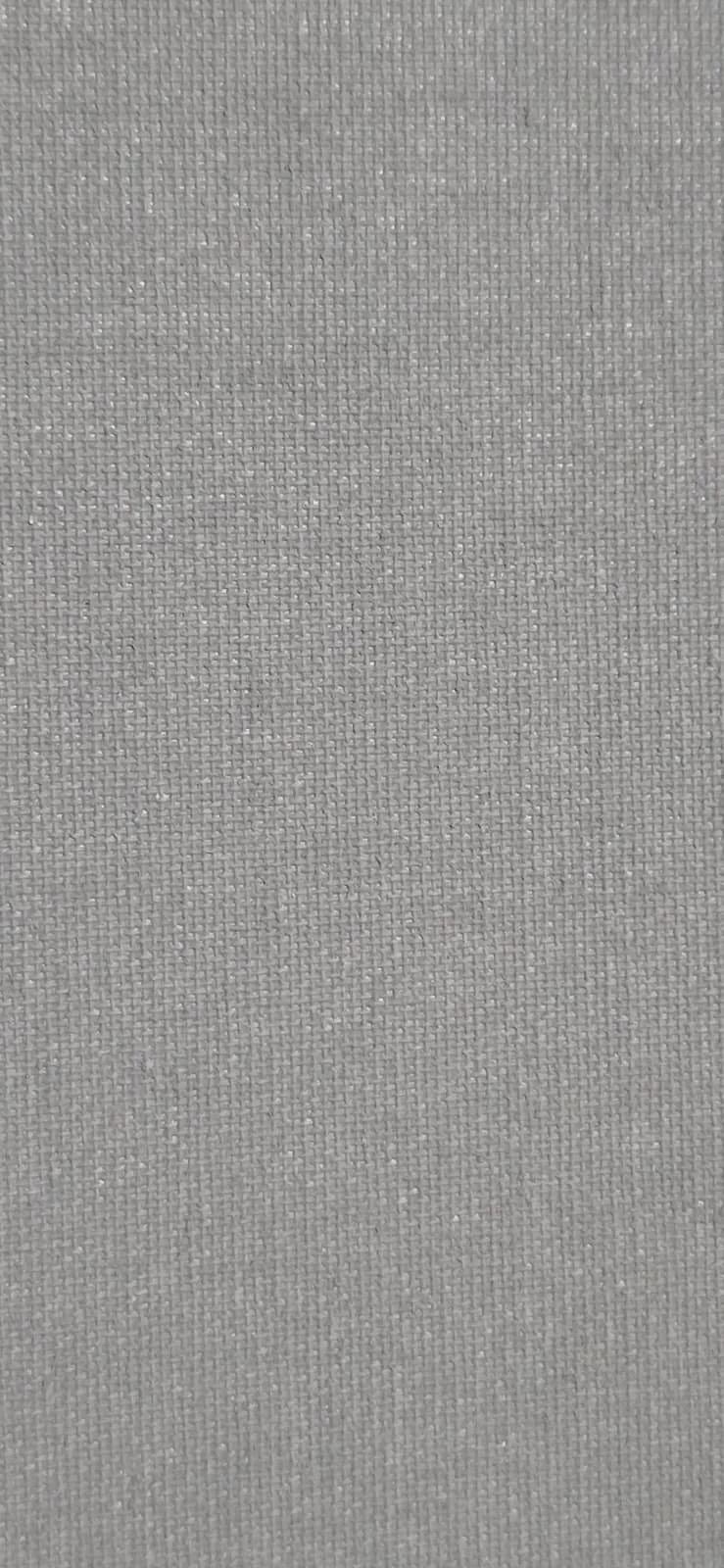 Close-up of a gray, textured fabric surface.