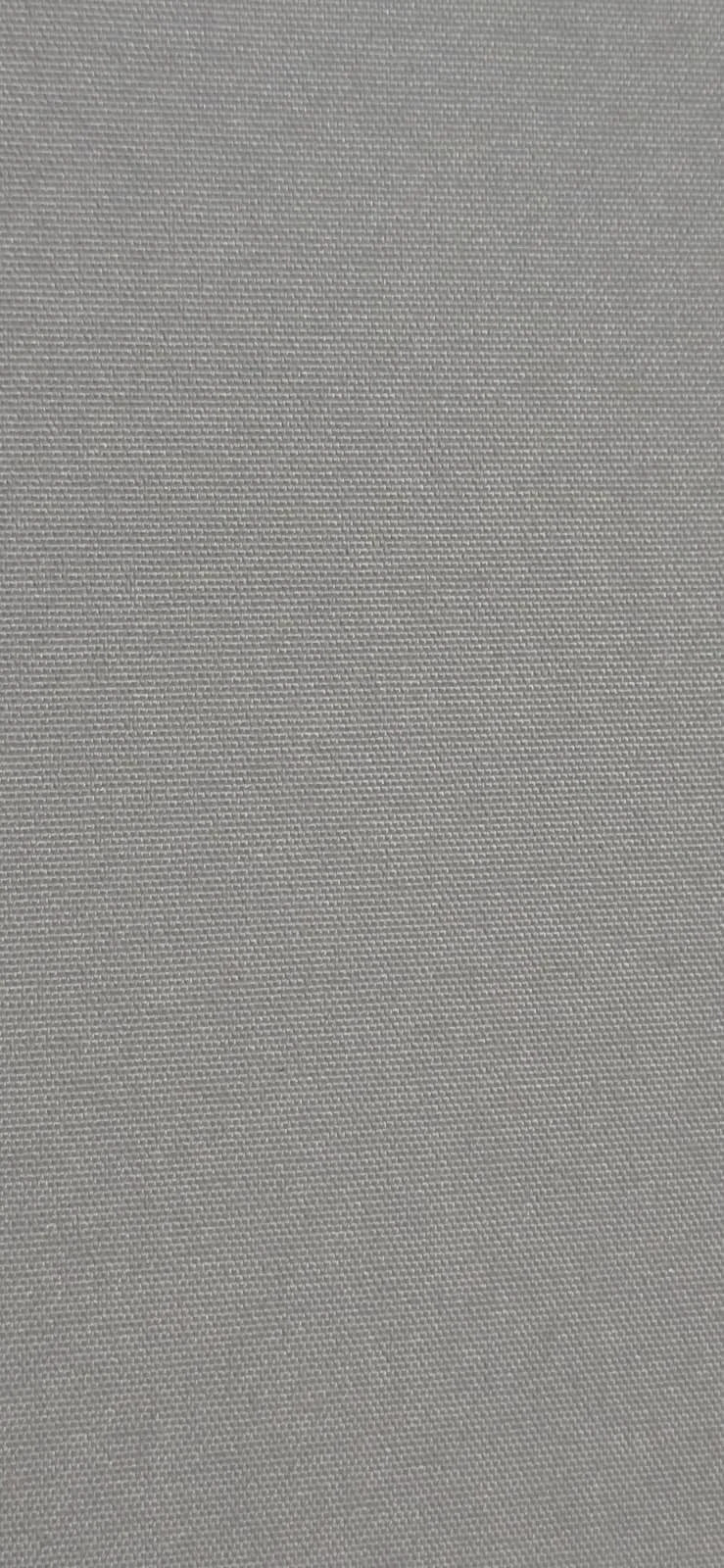 Close-up of a textured gray fabric surface, possibly upholstery or a textile material.