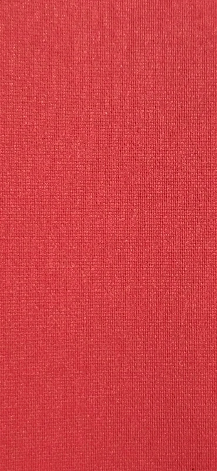 Close-up of red fabric with a textured weave.