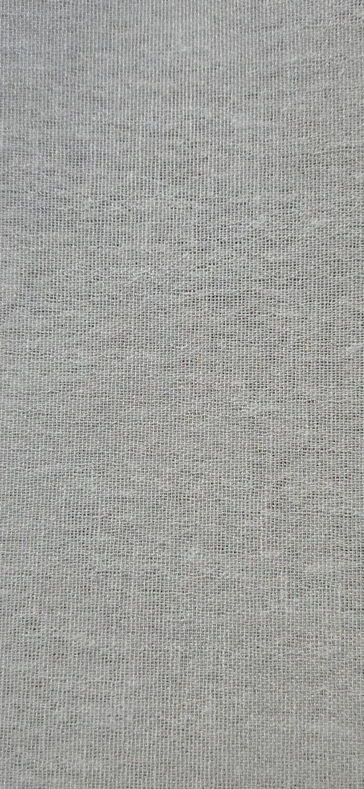 Close-up of beige linen fabric with visible weave pattern.