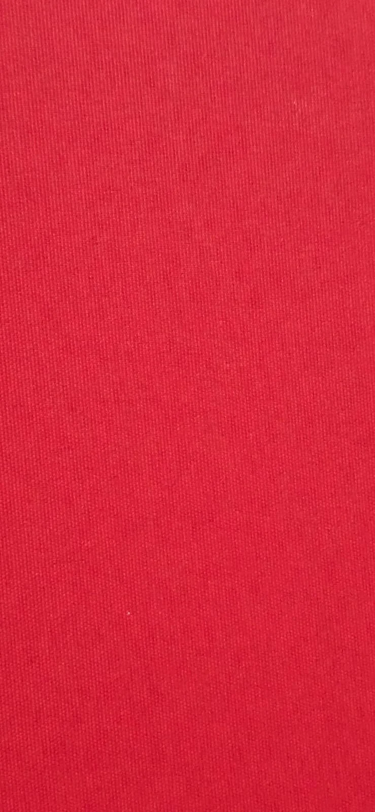 Close-up view of red fabric with a textured pattern.