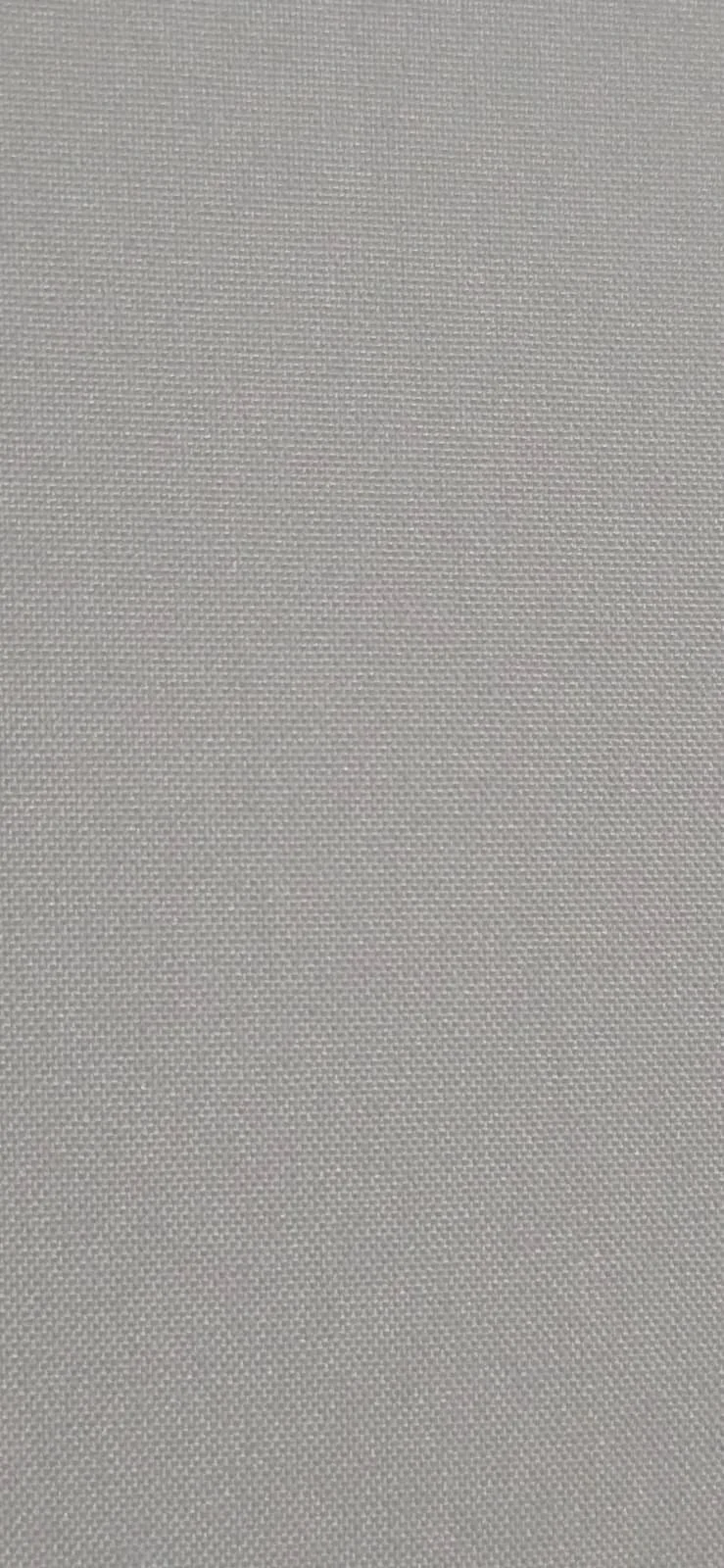 Close-up of a textured, light-colored fabric surface.