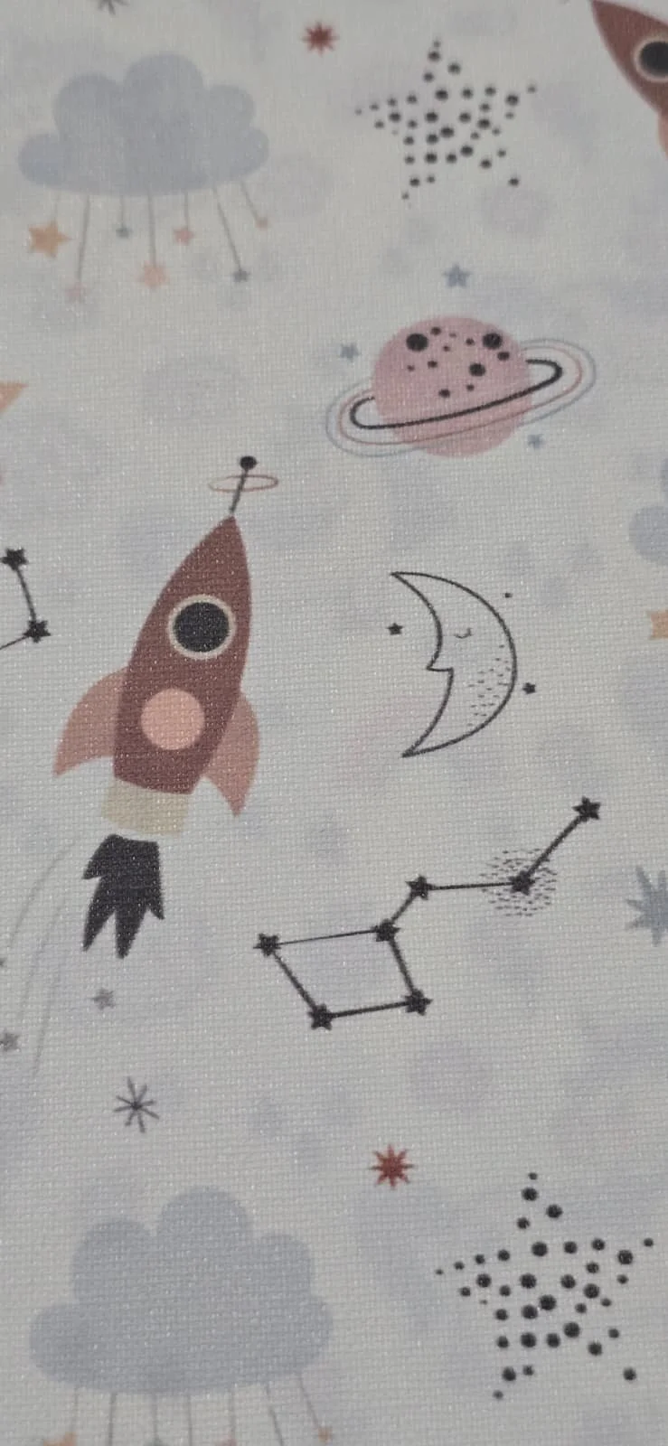 Space-themed pattern featuring a rocket, moon with stars, planets, clouds, stars, and constellation outlines.