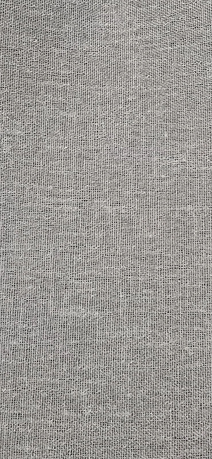Close-up photo of a woven fabric or textile with a small, tight pattern.