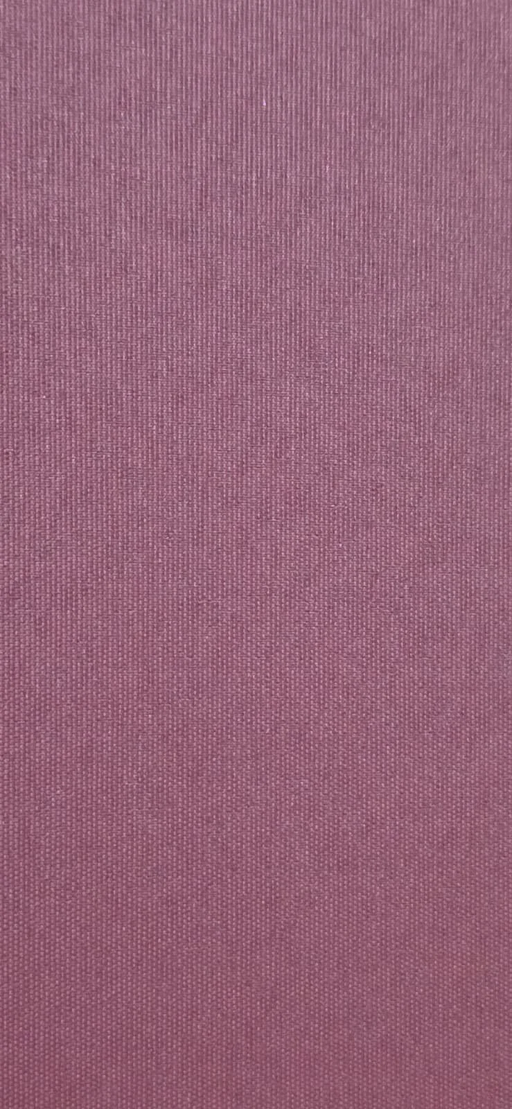 Close-up view of purple and pink fabric with a textured surface.
