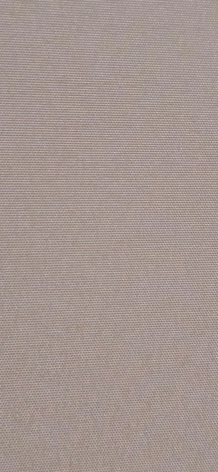 Close-up of beige textured fabric surface.