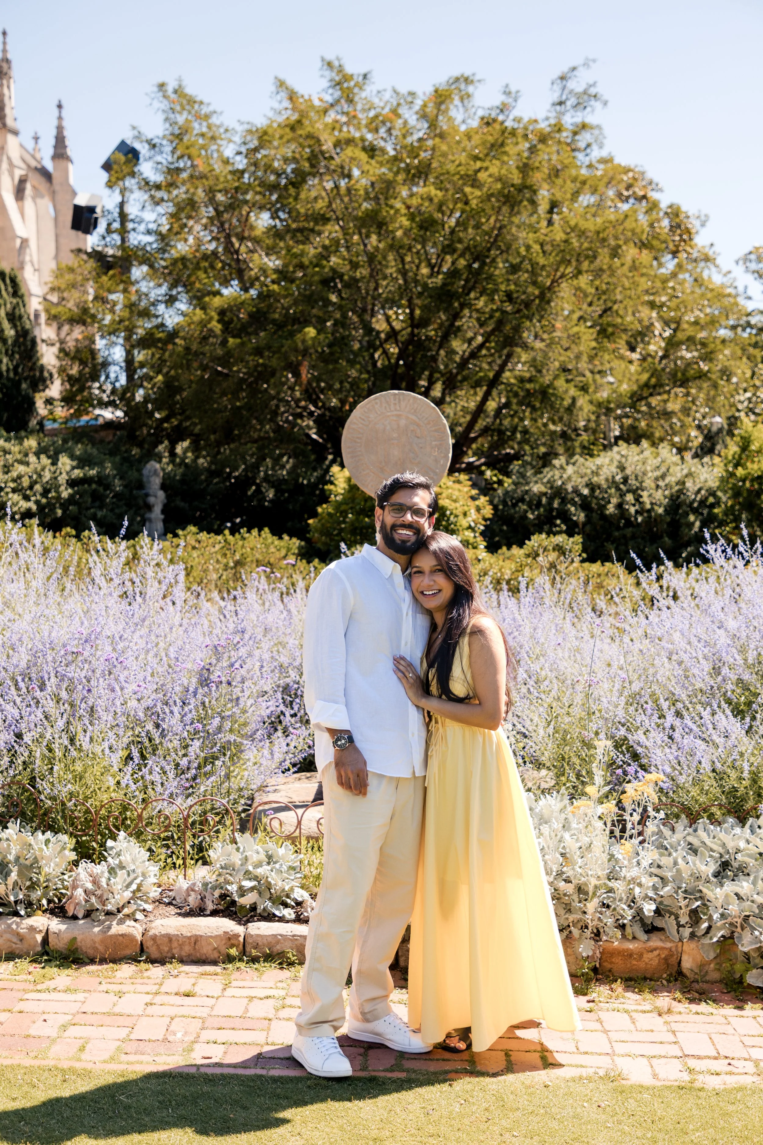 Engaged couple embracing in a lavender garden, Maryland engagement photography
