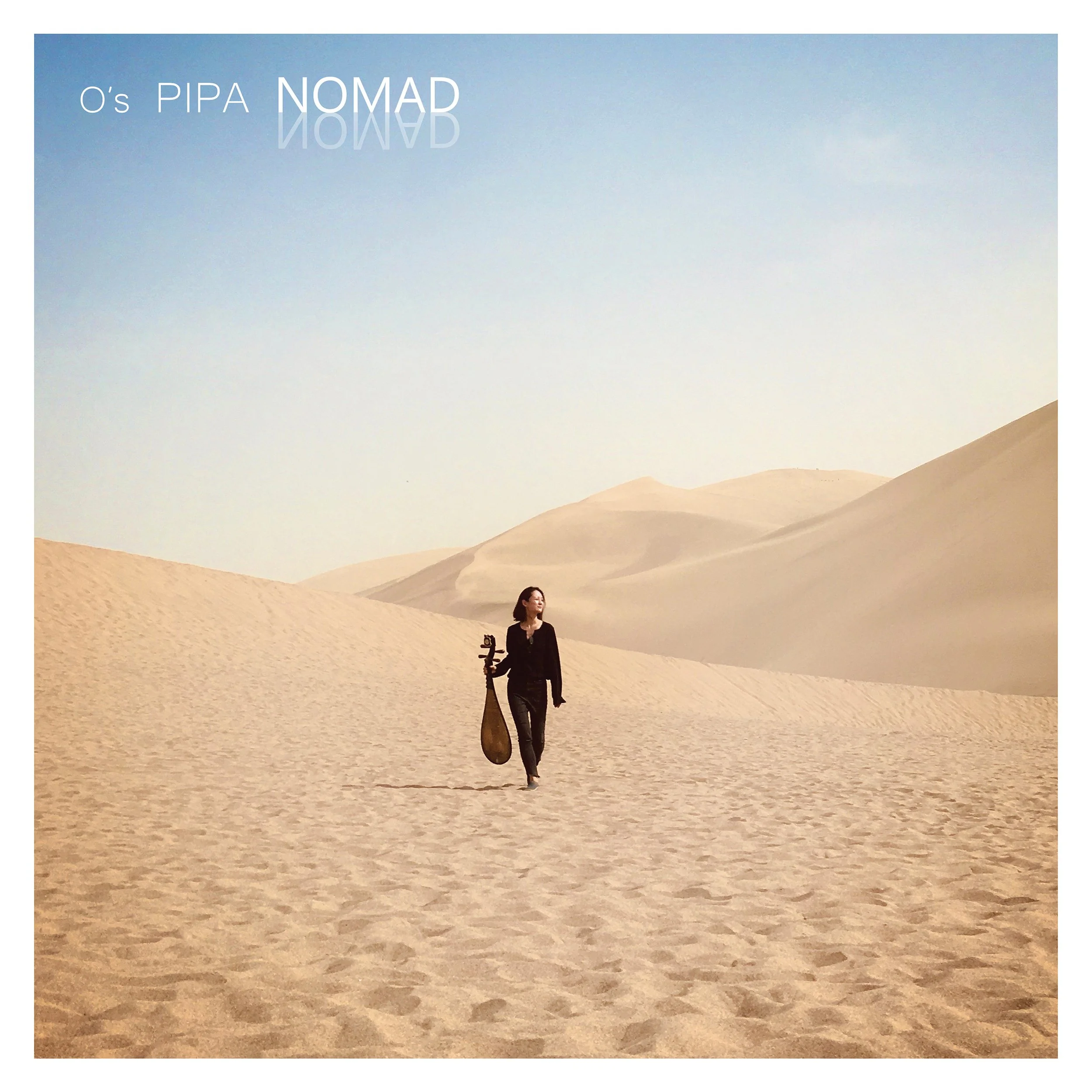 Woman walking alone in desert with sand dunes, holding a Chinese pipa (Chinese lute)