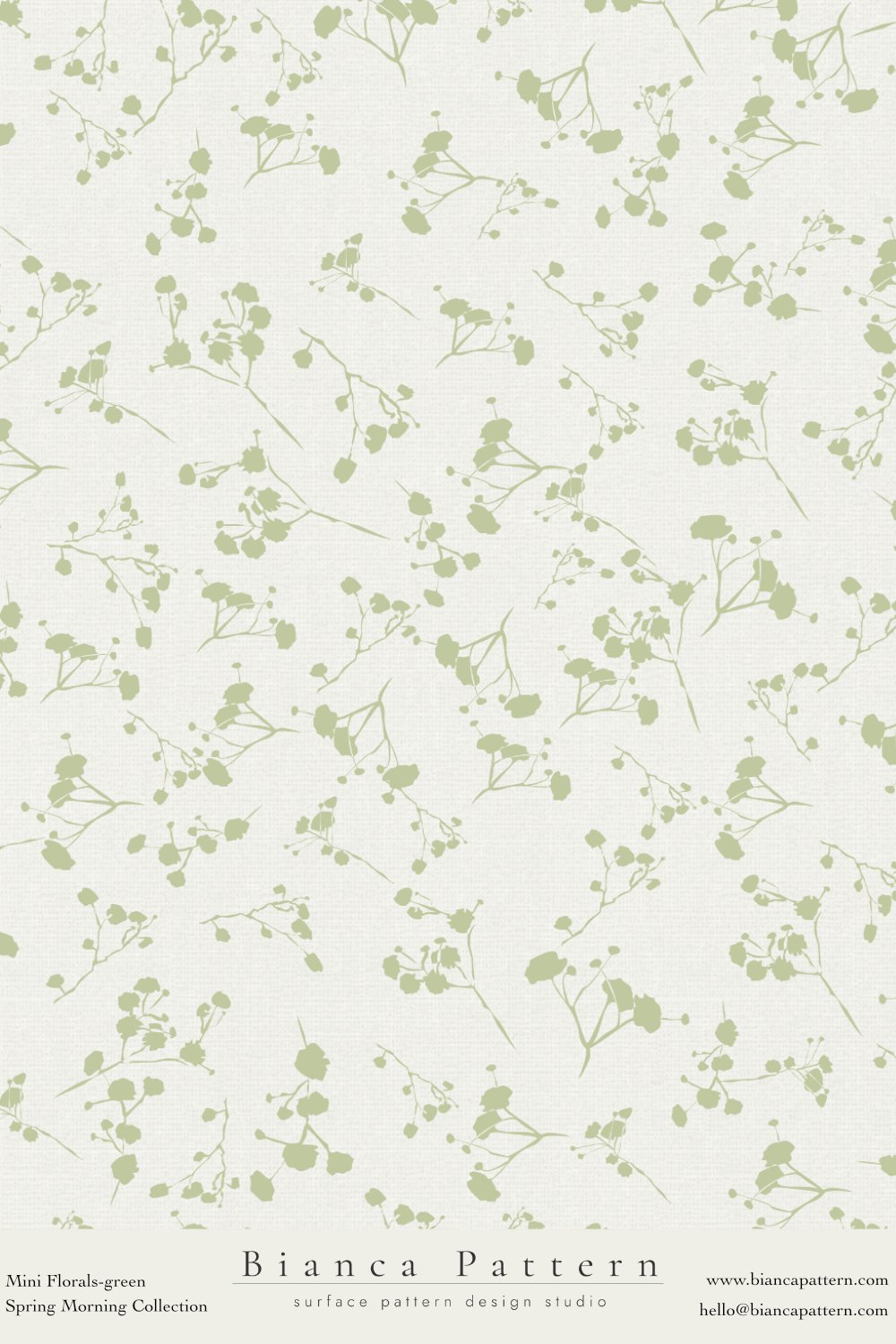 Light-colored wallpaper with a green floral pattern of small branches and leaves, from the Bianca Pattern Spring Morning Collection.