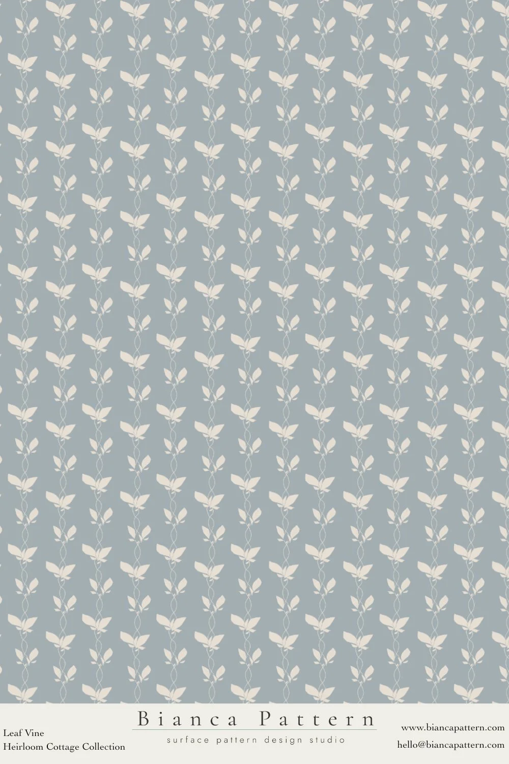 A repeating pattern of white leaf vines on a muted blue-gray background, labeled 'Bianca Pattern' from Leaf Vine collection.