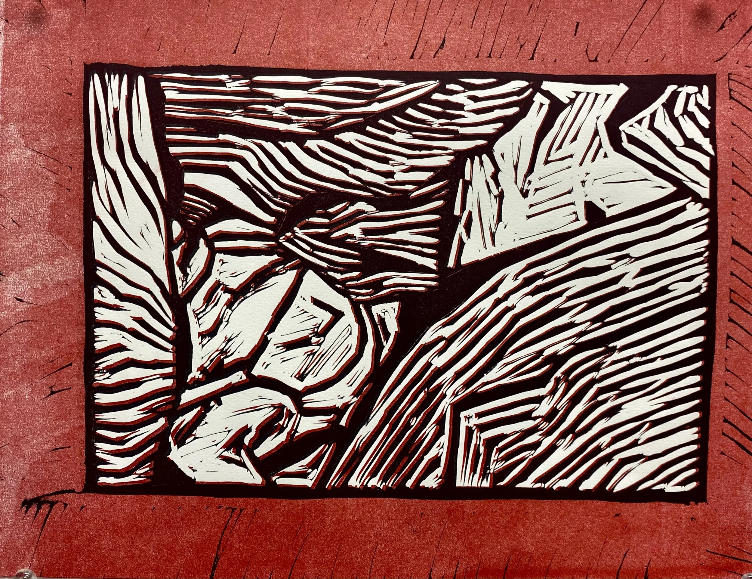 An abstract black and white print, with red background.