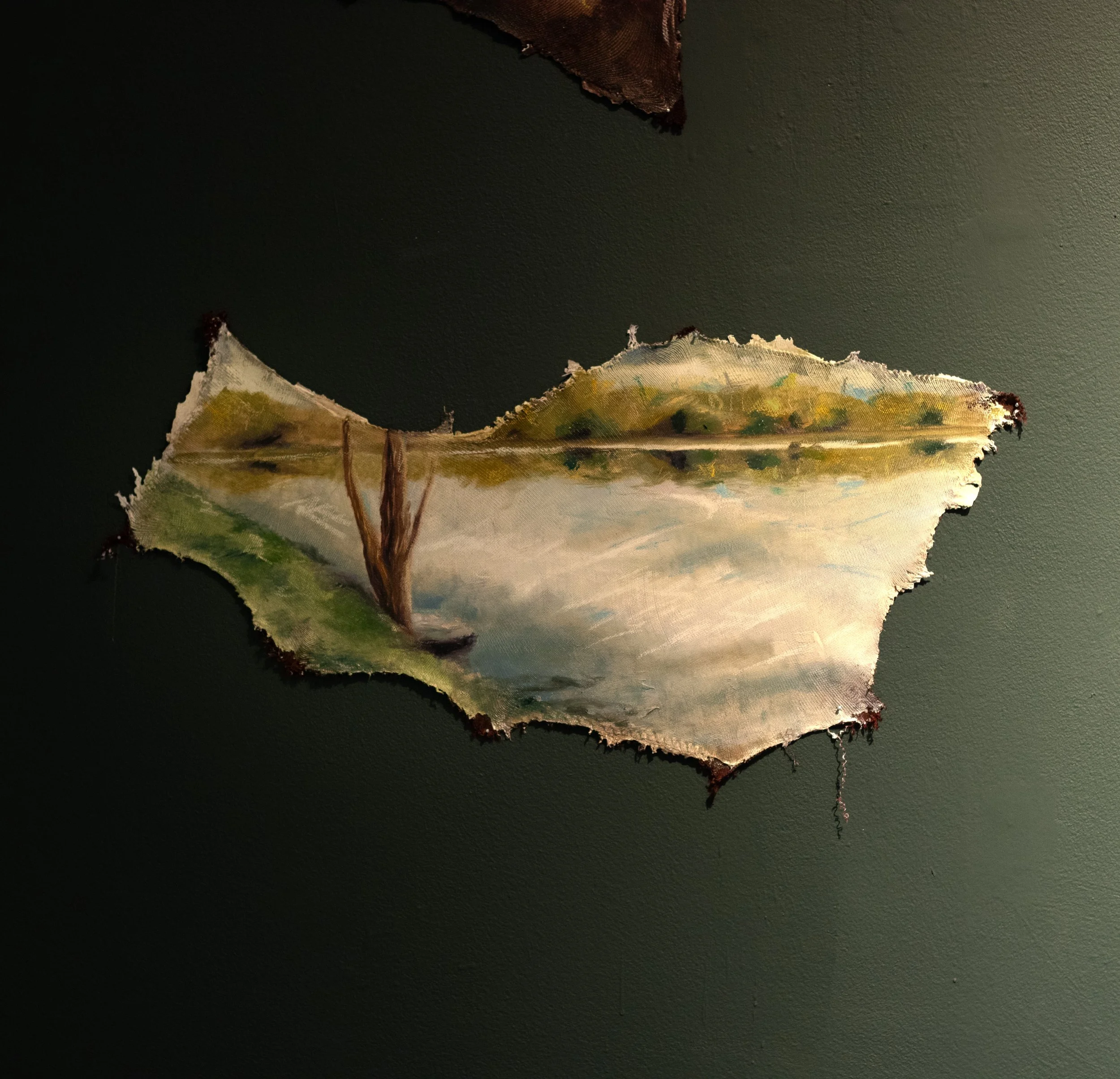 Painting of a landscape scene with water, trees, and rolling hills seen through a torn piece of fabric or paper.