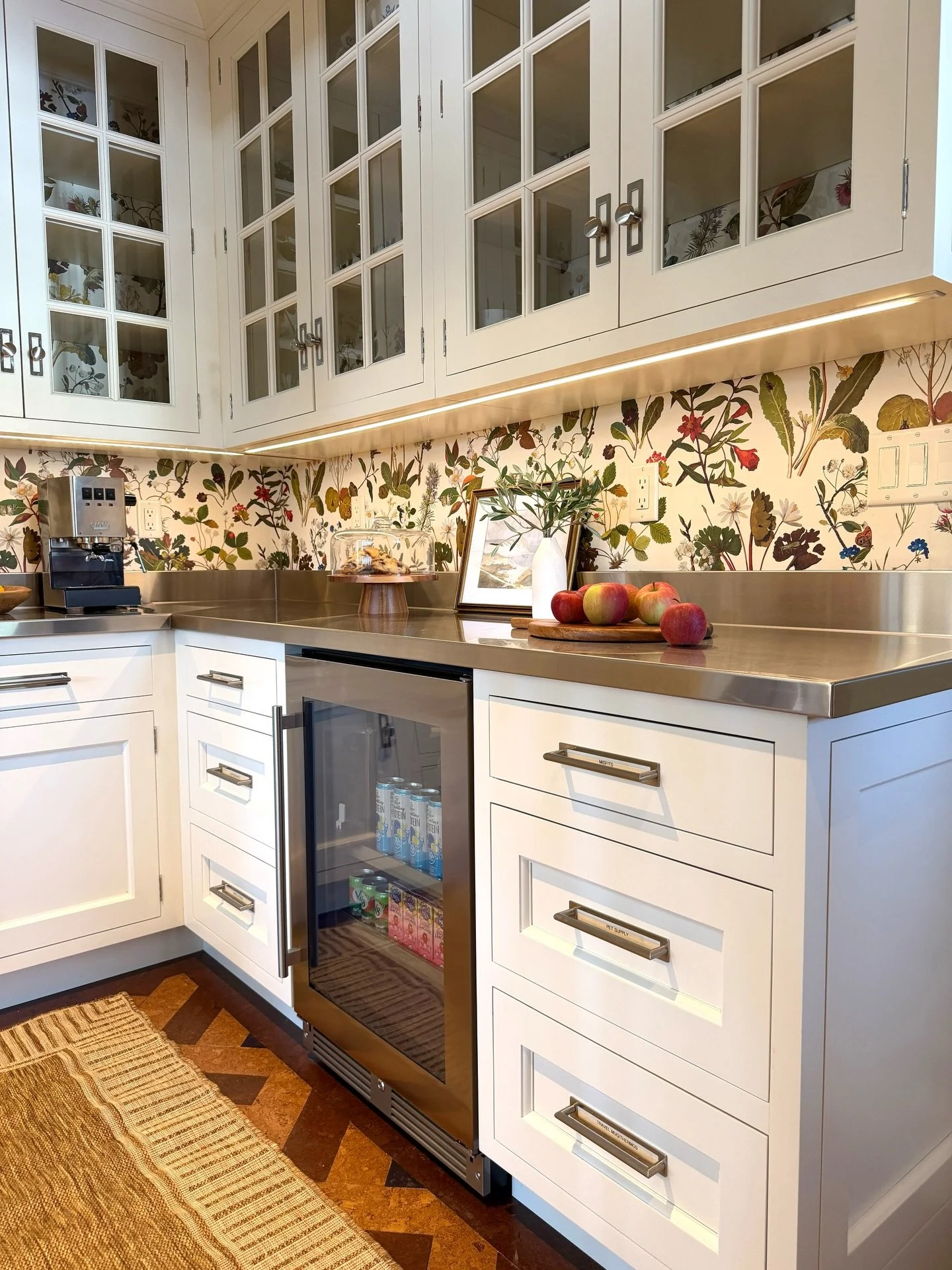 This pantry got a complete refresh, with new cabinetry, Custom stainless steel counters and a beautiful Wallpaper mural that extends inside of each of the upper cabinets.

A dreamy place to prep a special meal or morning coffee.