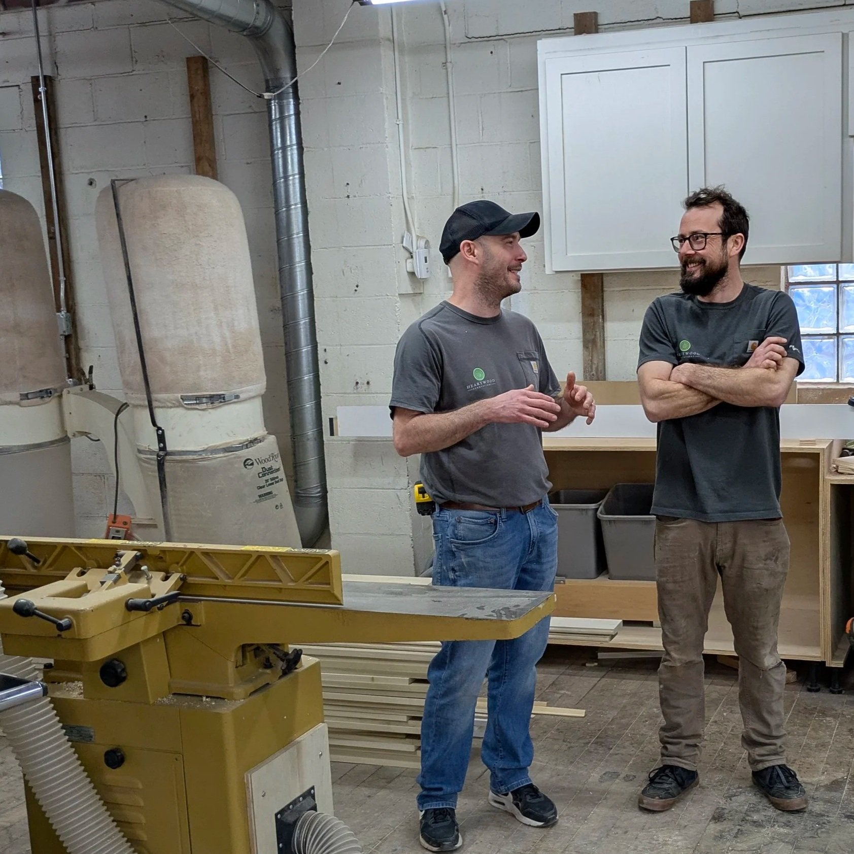 Bryan and Dimitry of Heartwood Renovations talking through a project in the company’s West Hartford, CT woodshop