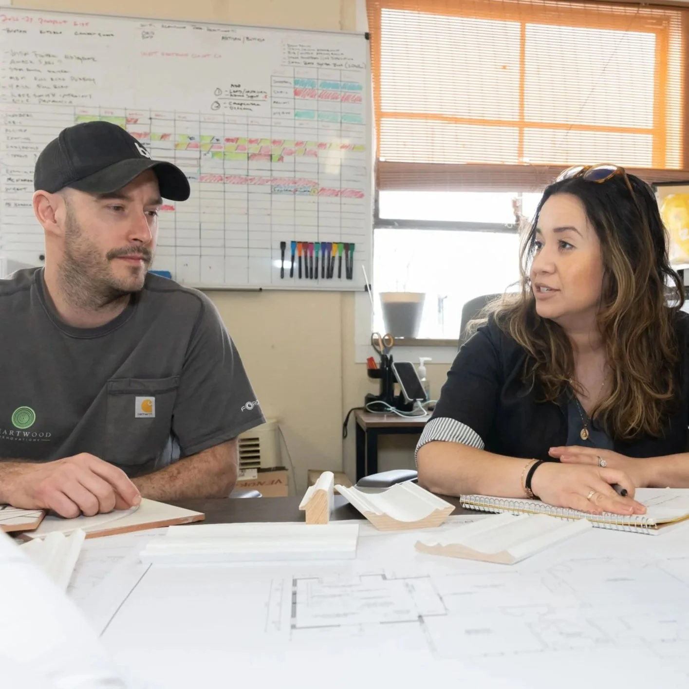 Heartwood Renovations team members reviewing remodel plans together in West Hartford, CT