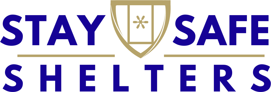 Graphic with blue and gold text that reads 'Stay Safe Shelters,' featuring a shield emblem with a cross and star in the center.