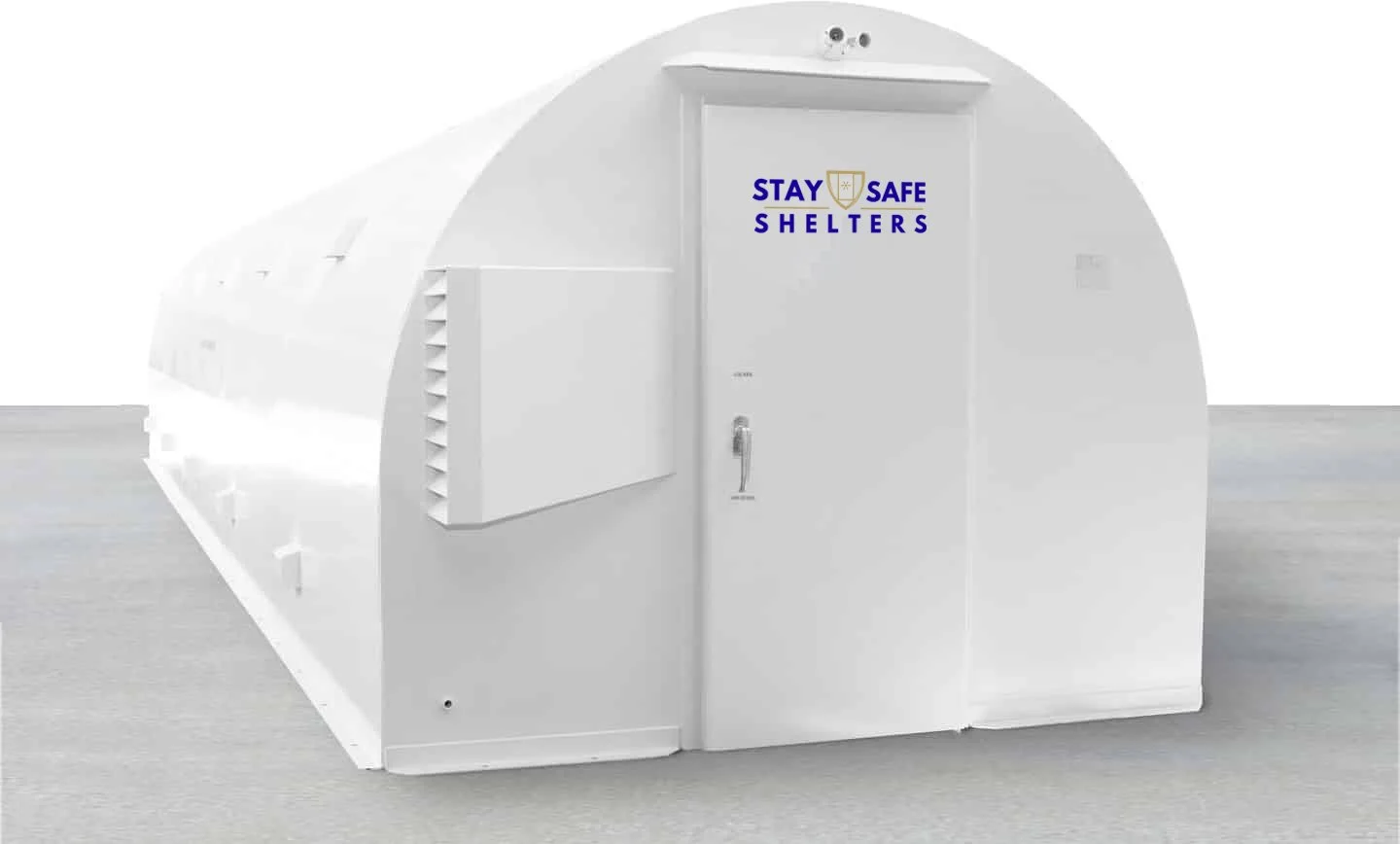 A white inflatable shelter with a door labeled "STAY SAFE SHELTERS" and the words "STAY SAFE" and two small logos above the door.