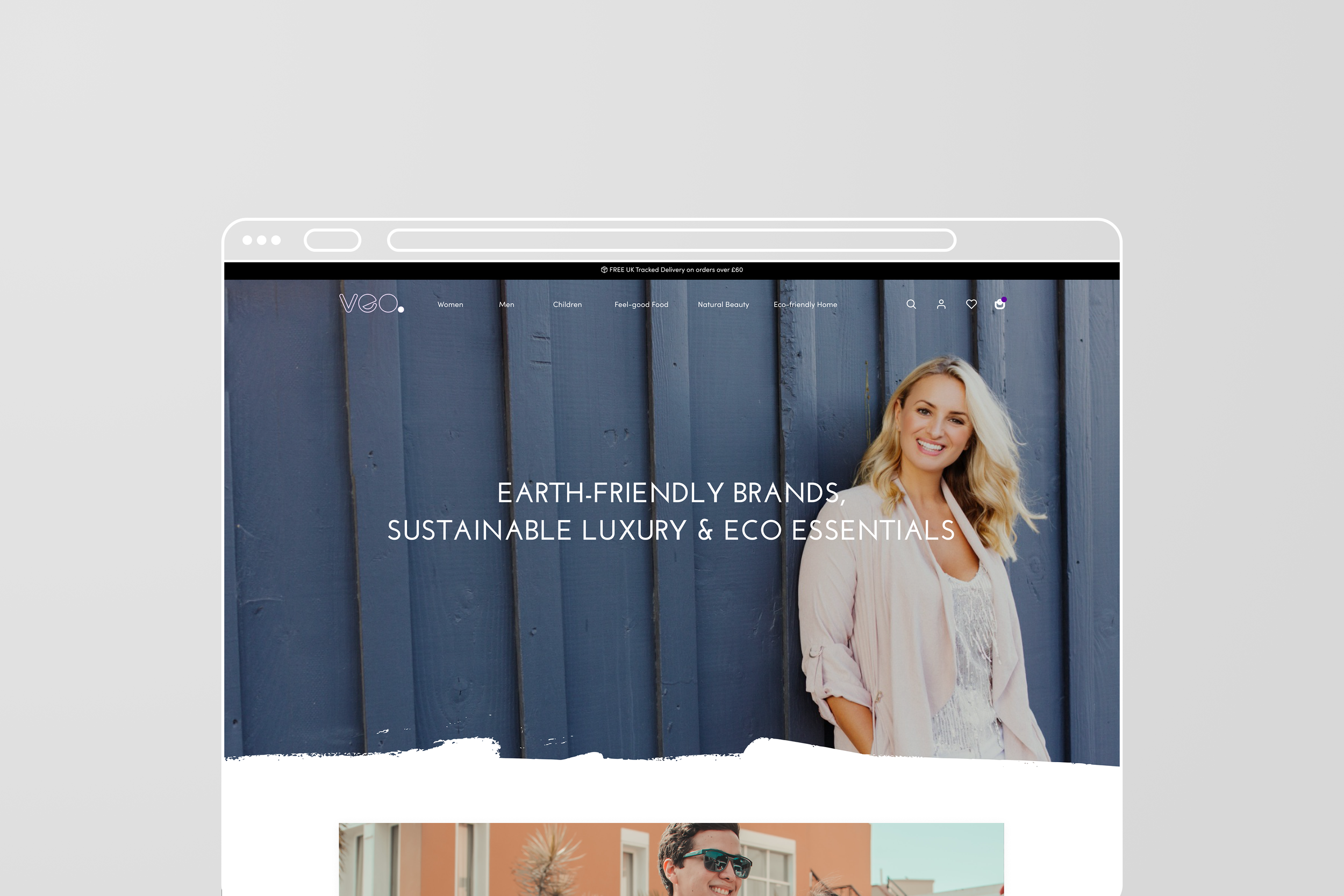 Website homepage showing a woman smiling against a blue wooden fence, with text promoting earth-friendly, sustainable luxury and eco essentials.
