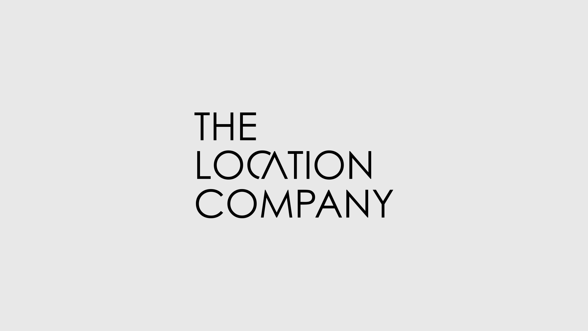 The Logo of The Location Company on a gray background.