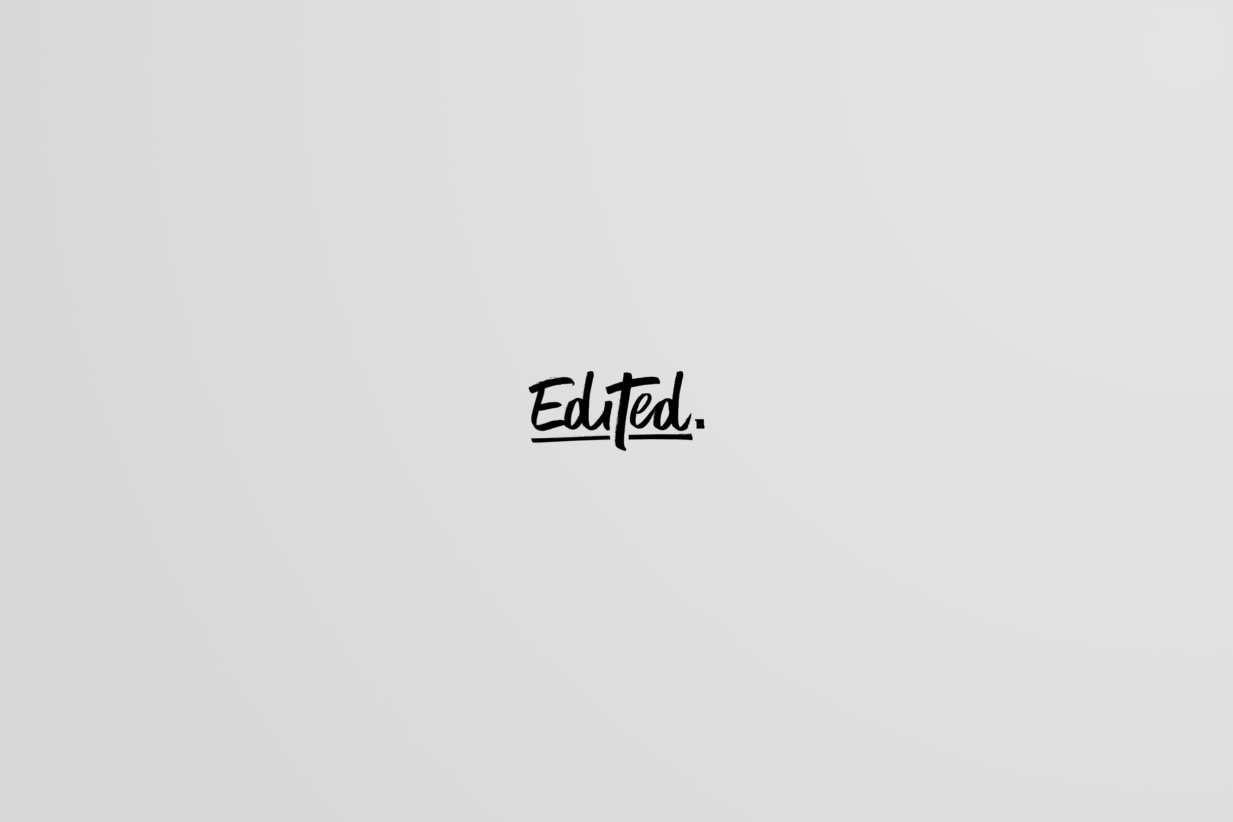 Centered text that reads 'Edited.' on a light gray background.